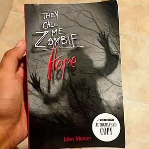 An autographed copy of John Mercer's I am zombie